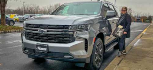 A happy customer with her new Chevrolet Tahoe